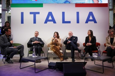 The panel onstage at the press conference hosted by Italy