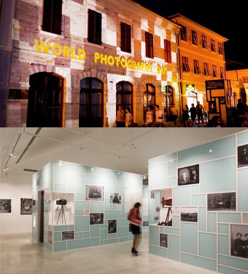 Above an illuminated facade, below a museum with photographs on display.